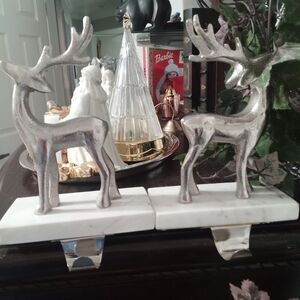 Silver Reindeer Stocking Holders On Marble Base